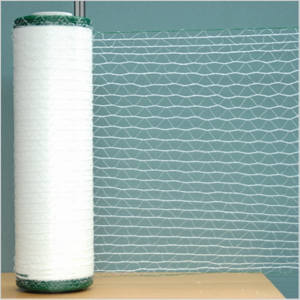 A roll of white bale hay net