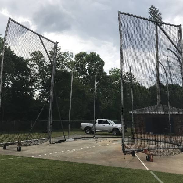 Hammer-discus cage net is installed in the community running tracks.