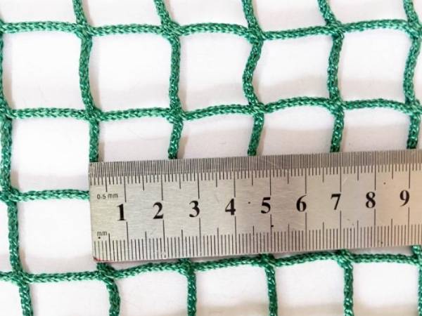 A ruler is used to test the thread diameter of the football net.