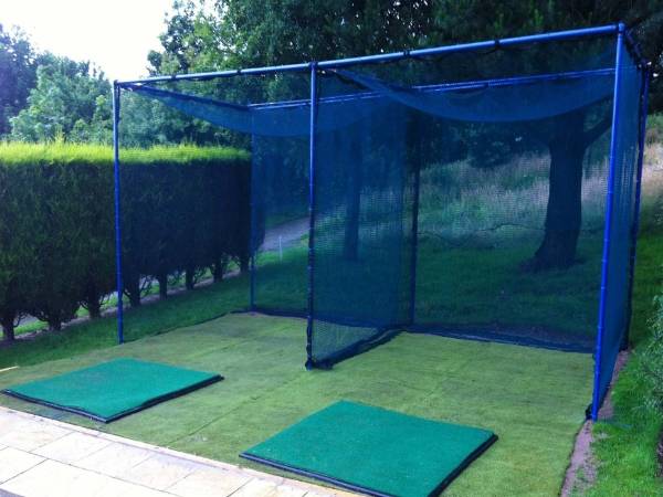 Golf cage nets are placed in parallel on the ground.