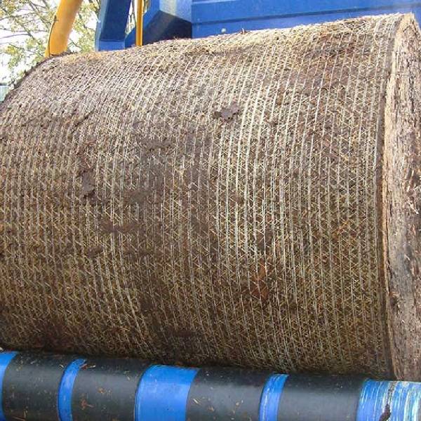 Baled horse dung on the machine