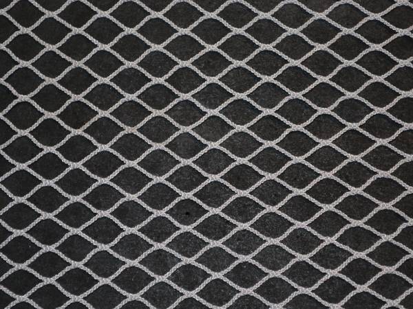 White nylon knotless netting on a black background
