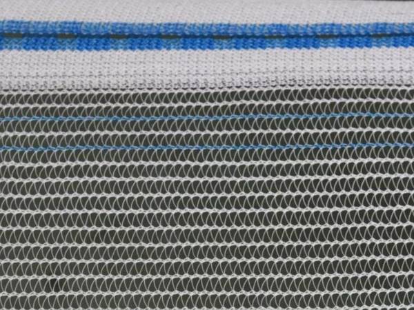 Raschel drape hail netting on a black background