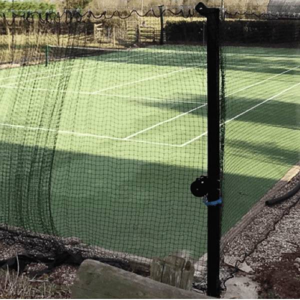 Sports perimeter net is installed around the badminton court.