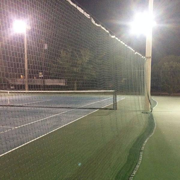 Sports perimeter net is installed around the tennis court.