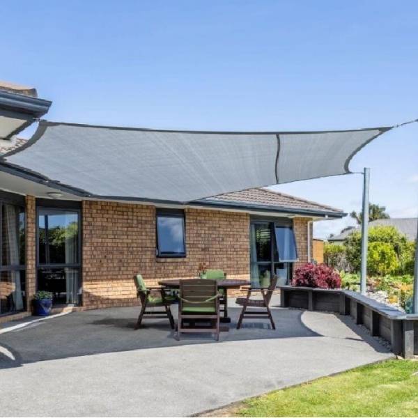 Sun shade sail installed in the yard